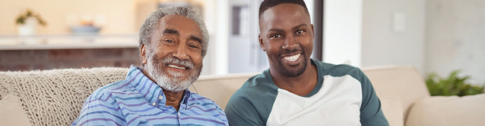 adult and senior man smiling